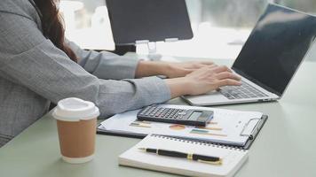 Businessman working with smart phone and laptop and digital tablet computer in office with digital marketing media in virtual icon video