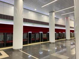 perspective view of High speed train with opened automatic doors at the platform railway station without people photo
