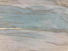 gray texture. there is a gold stripe in the center. paint on canvas. the figure is volumetric, embossed. light shadow on canvas with ink. romantic cute background photo