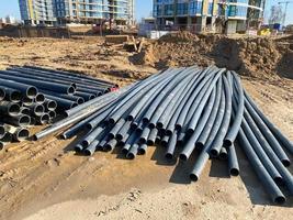 Modern polypropylene pipes for conducting heating mains underground. Durable and anticorrosive properties of water pipes, drainage system photo