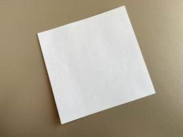 Small square pieces of paper for notes and notes on the working office desk with stationery. Business work photo