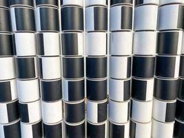 Texture of black and white cylinders and squares for counting on the playground for children. The background photo