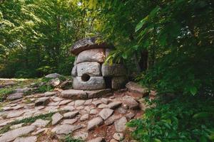 Ancient round compound dolmen in the valley of the river Jean, Monument of archeology megalithic structure. photo