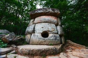 Ancient round compound dolmen in the valley of the river Jean, Monument of archeology megalithic structure. photo