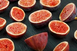 Ripe sweet figs on a black background. photo