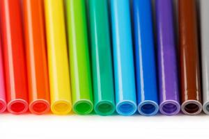 Multi-colored felt-tip pens, markers on a white isolated background photo