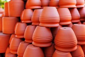 Handmade ceramic crockery made of clay of brown terracotta color photo