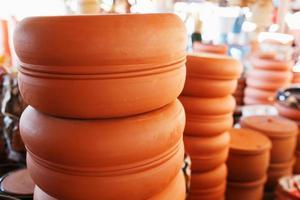 Handmade ceramic crockery made of clay of brown terracotta color photo