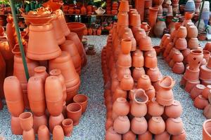 Handmade ceramic crockery made of clay of brown terracotta color photo