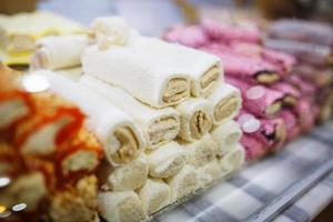 Eastern sweets, confectionery on the counter, Sherbet, Dzhezerye, halva, Turkish delight baklava. photo