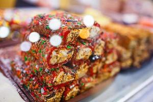 Eastern sweets, confectionery on the counter, Sherbet, Dzhezerye, halva, Turkish delight baklava. photo