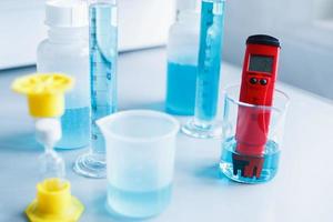 Analysis of water quality in a chemical laboratory, a device for measuring pH with equipment made of glass photo