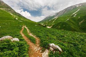 Stony path to the mountains through the pass Fisht-Oshten. photo