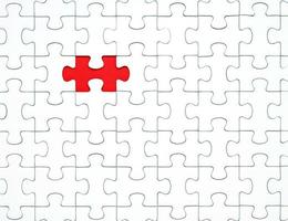 White puzzle pieces on a red background separated photo