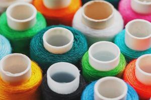 Colorful spools of sewing thread. Colored thread for sewing photo