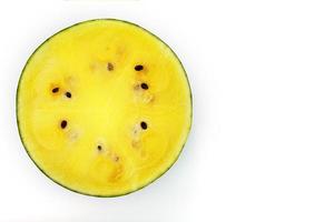 Half a juicy, yellow watermelon on a white background, texture of juicy pulp and mesmeses of ripe watermelon photo