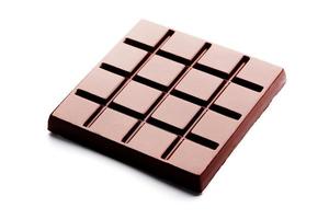 Dark chocolate square shape on a white background from top view. Isolate photo