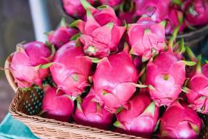 Fresh Pitaya - Dragon fruit in the basket for sale in the fruit market photo