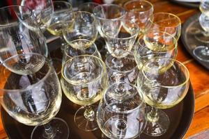 Champagne glass stand on the table - Empty glass of champagne or Wine glass photo