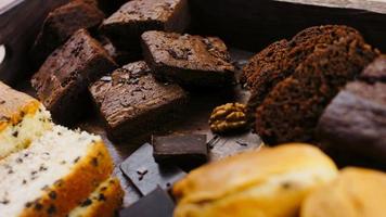 Different kinds of cakes arranged on a wooden tray video