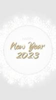 Happy New Year 2023 banner glittering golden circle. Gold sparkling ring with dust glitter graphic on white background. Beautiful numbers graphic design template. Luxurious gradient calendar vector