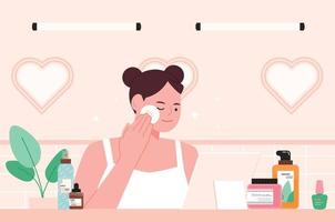 A girl is wiping her face with a cotton pad at the table with skincare products. vector