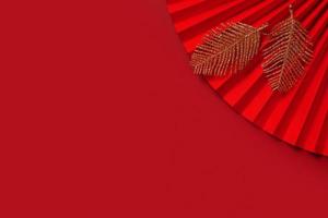 Paper fan symbol Chinese new year top view with copy space on red background photo