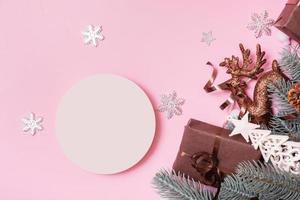 Blank podium or pedestal for skincare beauty products and Christmas decorations top view on pink background photo
