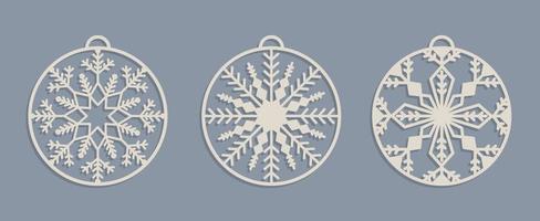 Set of Laser cut Christmas baubles Templates. Christmas tree wood decorations balls with snowflakes vector