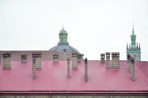 Fragment of a metal roof of the restored old multi-storey building in Lviv, Ukraine photo