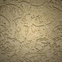 The texture of the beige decorative plaster in bark beetle style photo