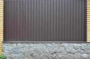 Metal wall with stone foundation photo