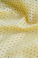 Yellow mesh sport wear fabric textile background pattern photo