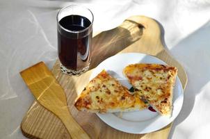 Hot pizza and cup of cola photo