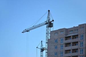 Building under construction with crane photo