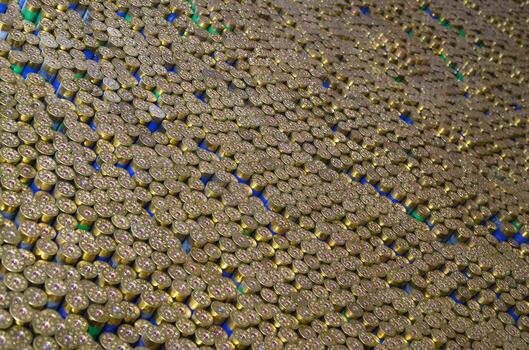 Pattern of 12 gauge cartridges for shotgun bullets. Shells for hunting rifle close up. Backdrop for shooting range or ammunition trade concepts photo