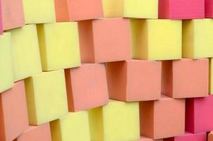 Wall of paralon soft cubes in dry pool, trampoline in the childrens center photo