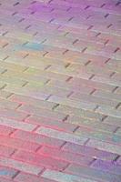 Multi colored paving slabs, powder coated with dry colors at the Holi festival photo