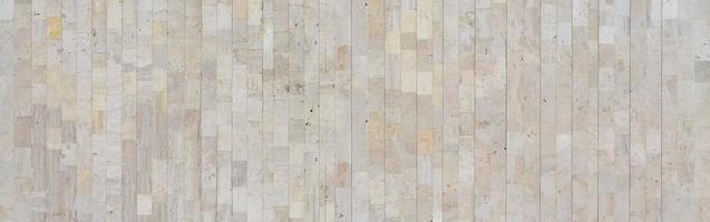 Background texture of old beige marble wall from a variety of large tiles photo
