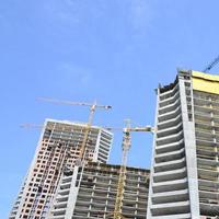 Construction site. High rise multi storey buildings under construction photo