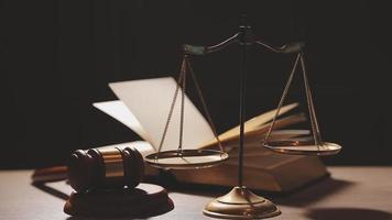 Justice and law concept.Male judge in a courtroom with the gavel, working with, computer and docking keyboard, eyeglasses, on table in morning light video