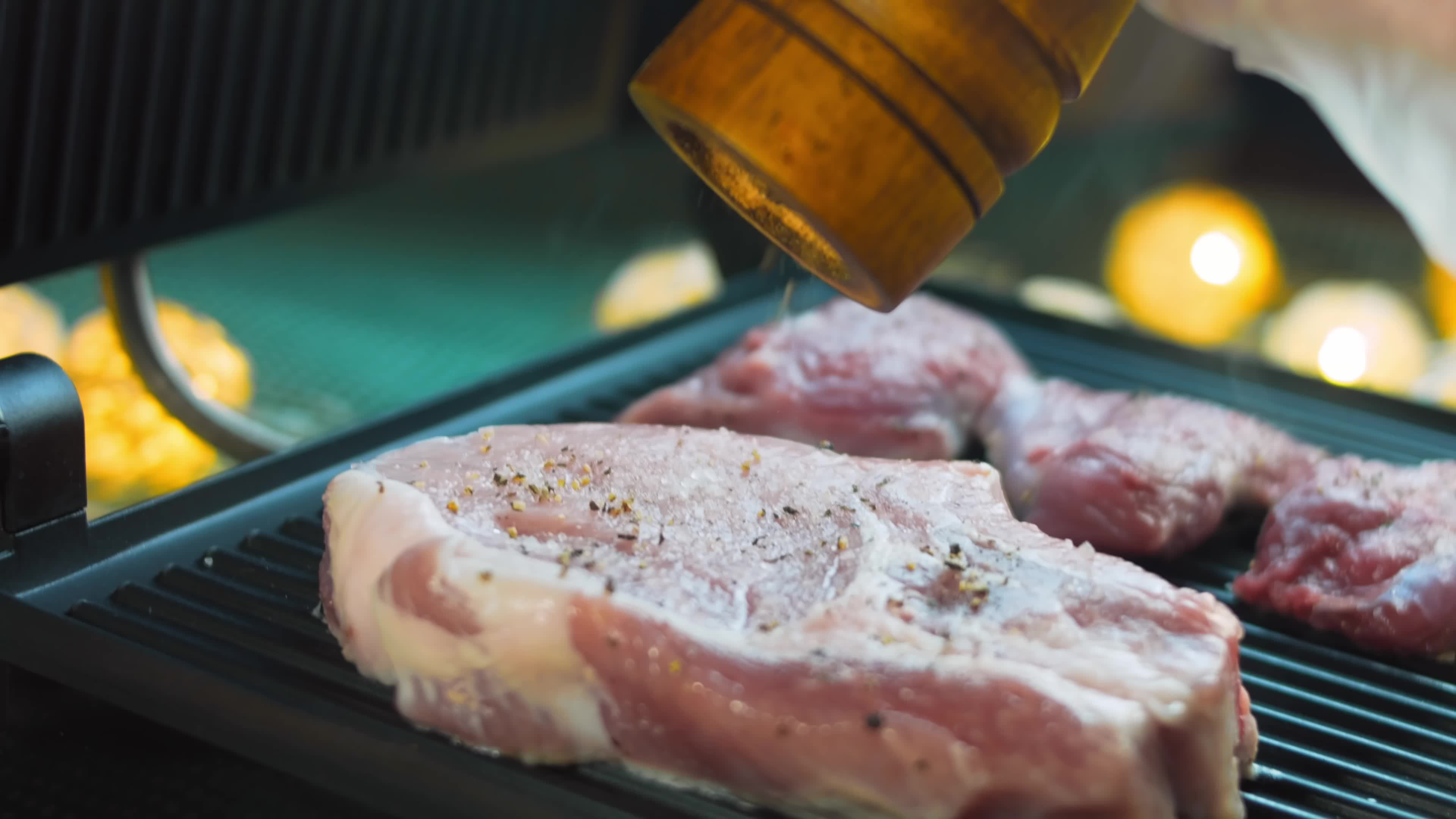 The chef grills pork and beef on the grill 14478220 Stock Video at Vecteezy