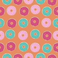 patrón sin costuras con donuts de colores sobre fondo naranja vector