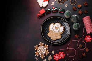 Beautiful different Christmas decorations and gingerbread on a brown concrete table photo