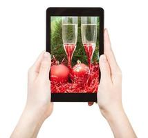 take photo of red Xmas still life with tablet pc