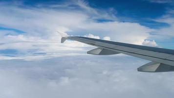 Footage view from the airplane window on the wing and beautiful blue clouds video