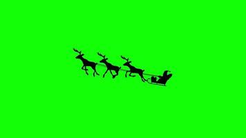 Santa Claus on a Reindeer Sleigh Flying on a Green Background, Silhouette animation with alpha channel. video