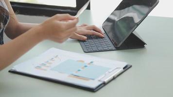 Businessman working with smart phone and laptop and digital tablet computer in office with digital marketing media in virtual icon video