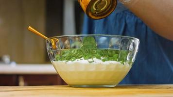 Sauce ranch arranged in a transparent bowl. Macro shooting video