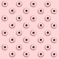 Many small plastic donuts lies on a pastel colorful background. Flat lay minimal pattern. Top view photo